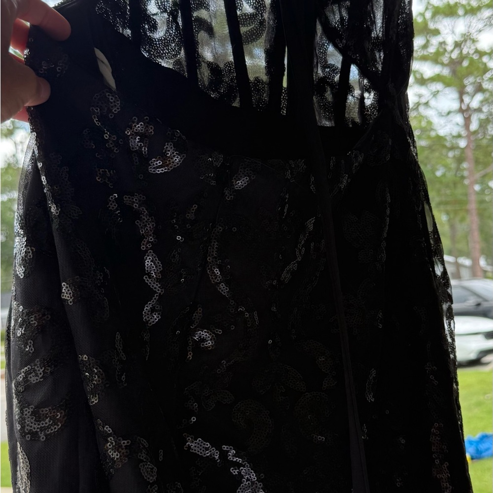Black sequin dress. Ties in back.